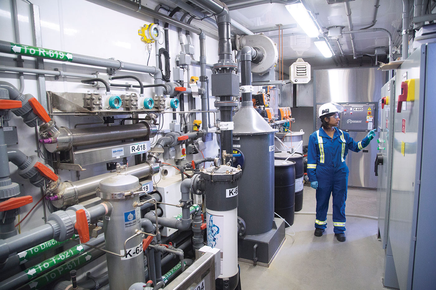 An operator checks data on wastewater treatment equipment