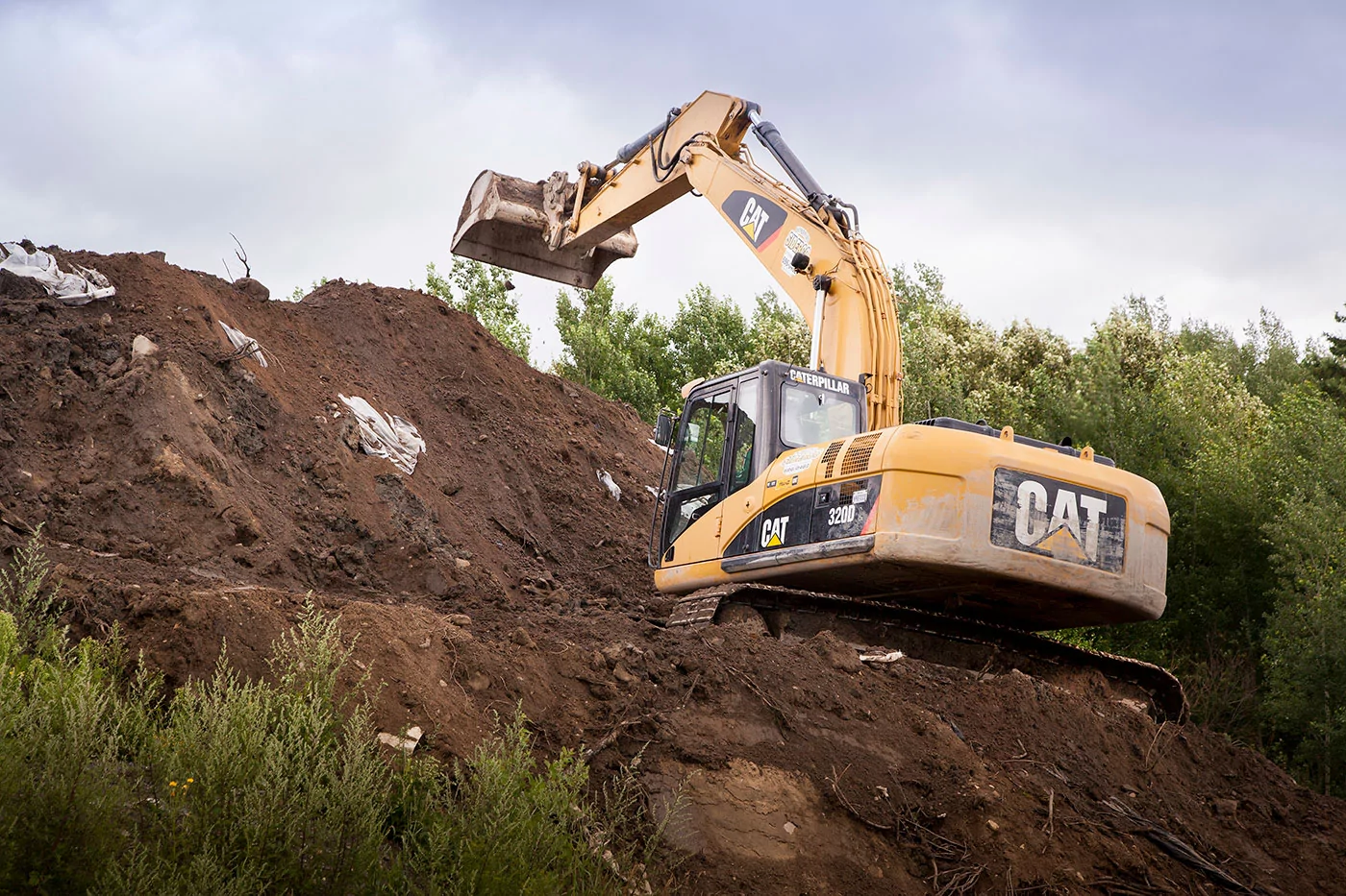 Backhoe removing soil